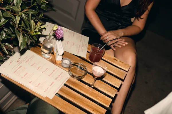 A table with menus and cocktails on the terrace at Čin Čin, Belgrade